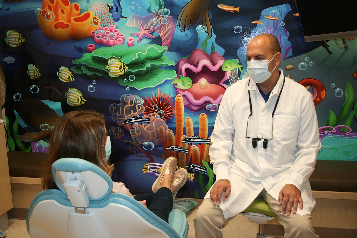 Moses Lake Community Health chief dental officer Brett Pack (right) said good dental health starts early.