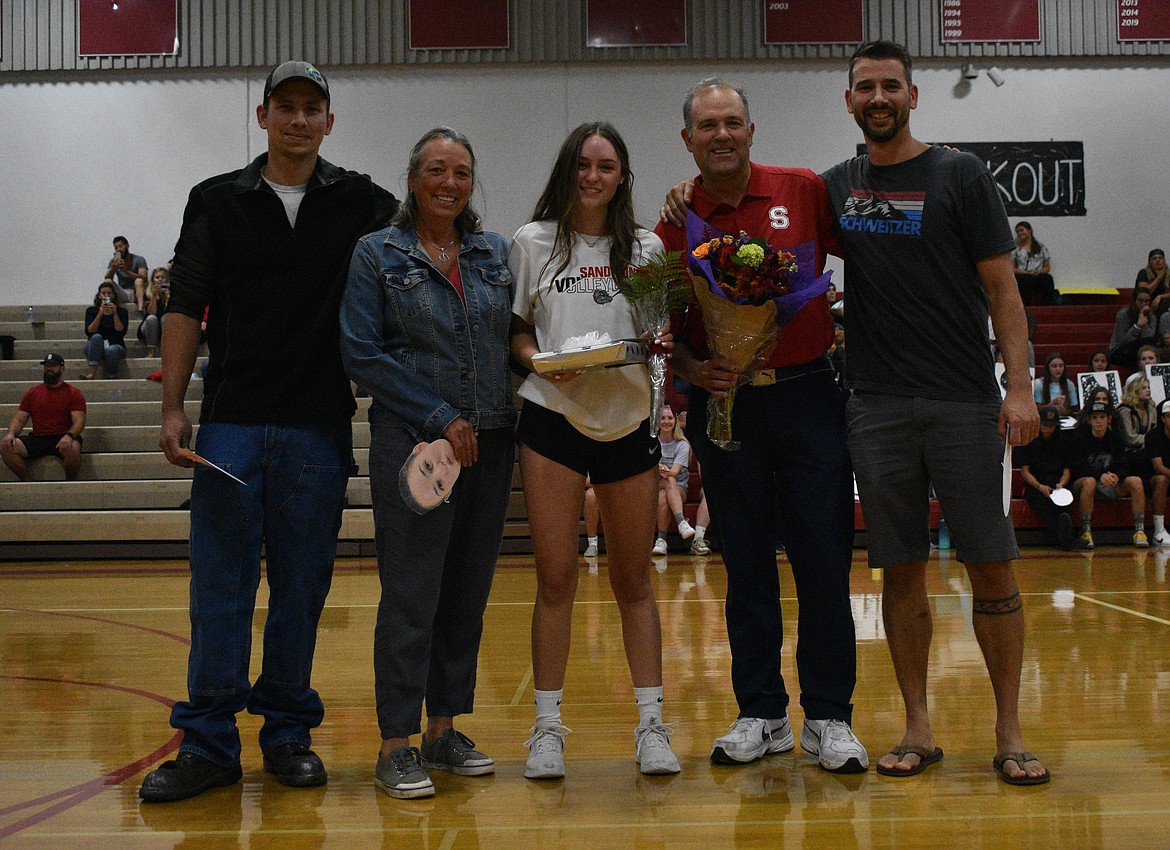 CeCe Deprez poses for a photo with her family on a Senior Night.