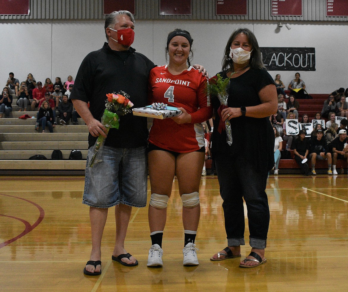 Kinzie Ward poses for a photo with her family on a Senior Night.