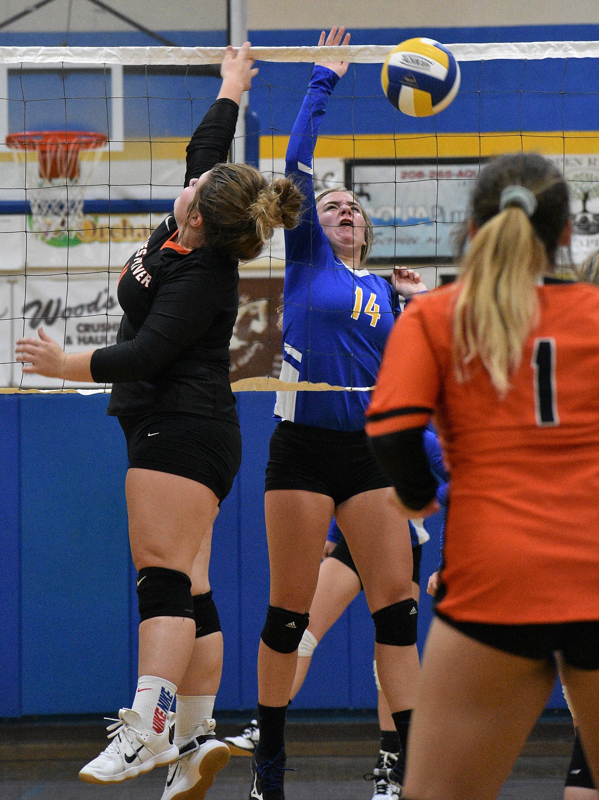 Junior Katelyn Matteson goes up for a block during Saturday's match.