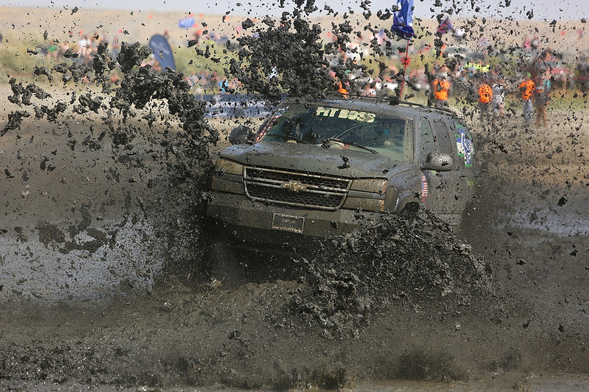 The "Pit Boss," Lloyd Standish's 2001 Suburban with an LBZ Duramax engine, rips through the mud at Saturday's Bounty Hole.