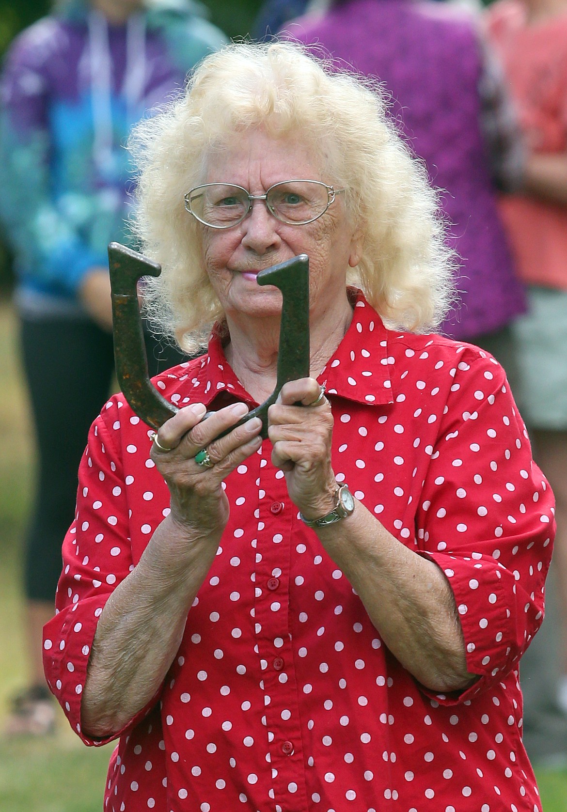 Carlena Shove takes aim with a horseshoe on Sunday at Winton Park.