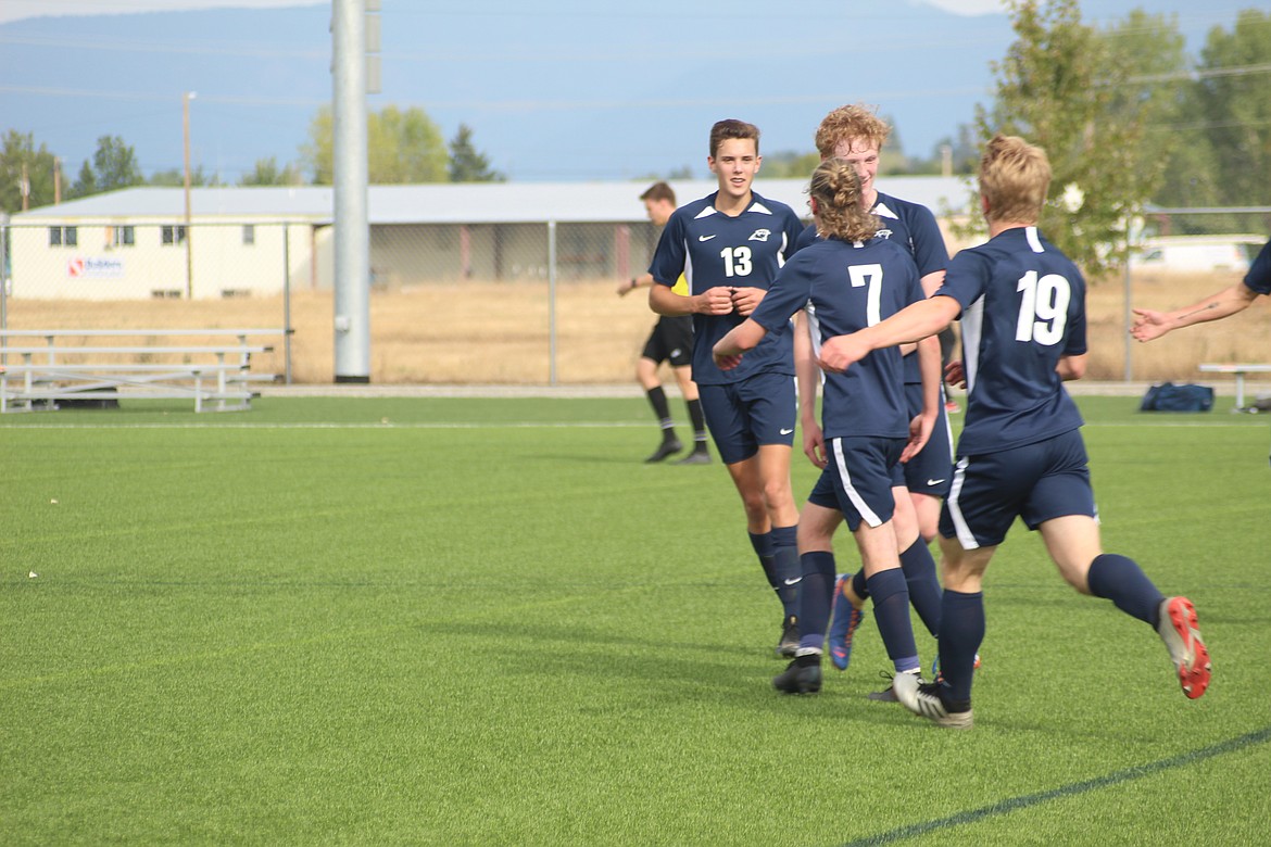 JOEL DONOFRIO/Press
Coeur d'Alene Charter senior Ronan Malaghan (7) celebrates his first-half goal with teammates.