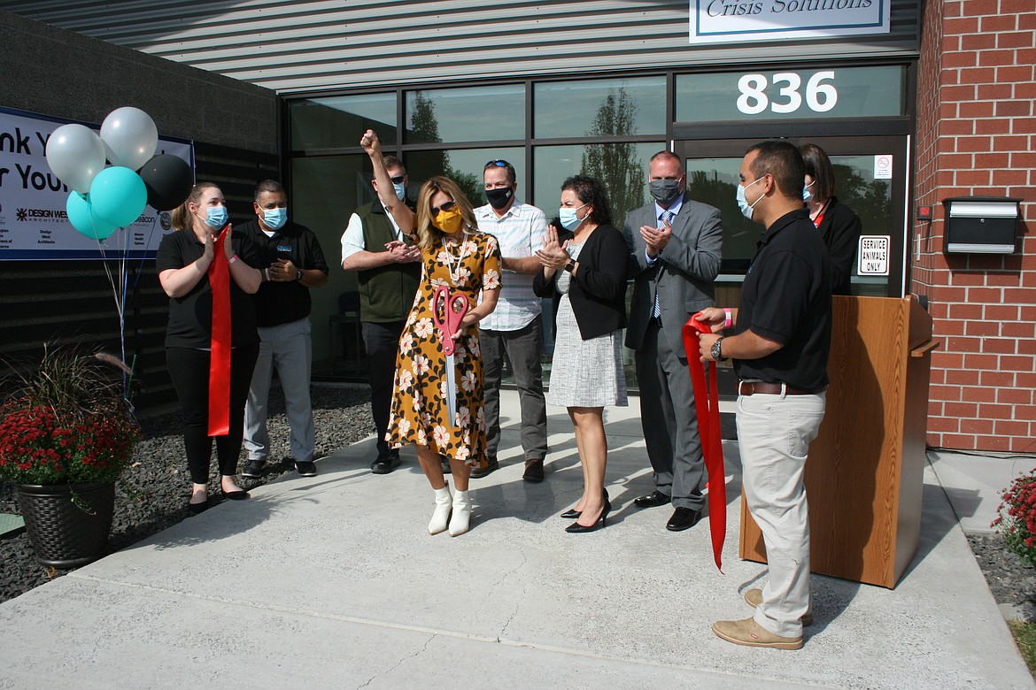 Grant County Commissioner Cindy Carter celebrates the opening of the new Crisis Solutions Center. Applauding with her are (from left) crisis center manager Traci Hunt, Grant Integrated Services quality manager Mike Lopez, Grant County Commissioners Richard Stevens and Tom Taylor, GIS chief financial officer Veronica Perez, GIS executive director Dell Anderson and crisis center supervisor Anselmo Quezada.
The facility will provide short-term treatment for people facing a mental health crisis.