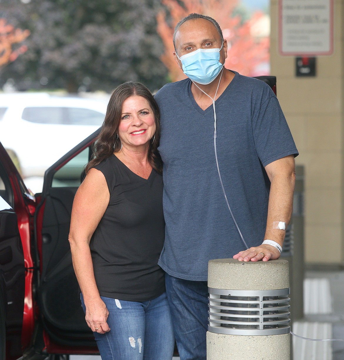 Pastor Paul Van Noy and wife Brenda pose together outside Kootenai Health on Monday.