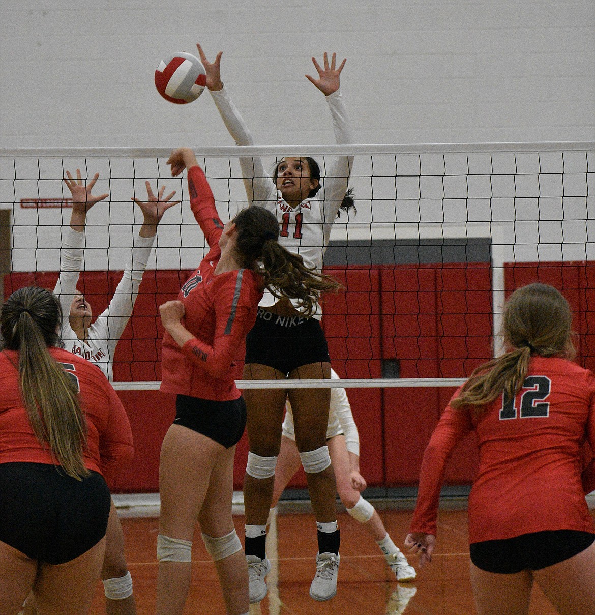 Senior Bella Phillips rises up for a block against Moscow on Tuesday at Les Rogers Court.