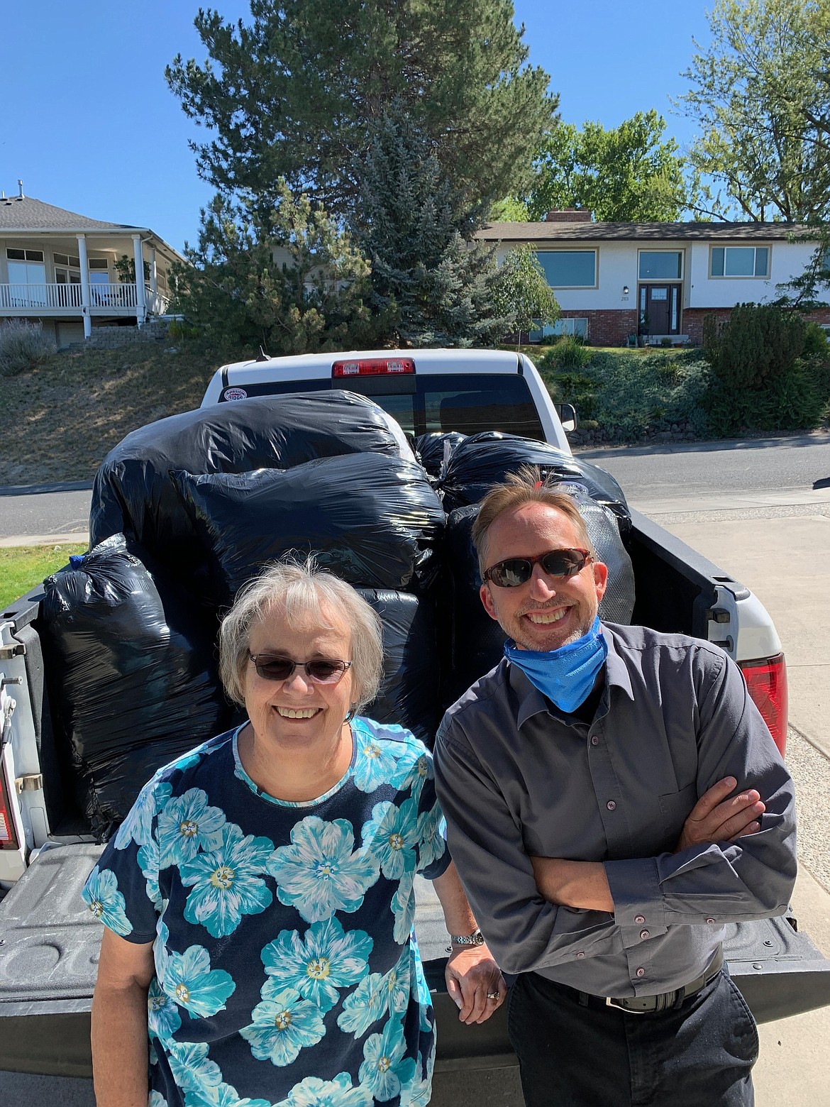 Holly Moos and Steve Ausere smile together after Moos stopped by to drop off 190 coats to be donated for the annual Coats for Kids drive that kicked off on Saturday, Sept. 19.