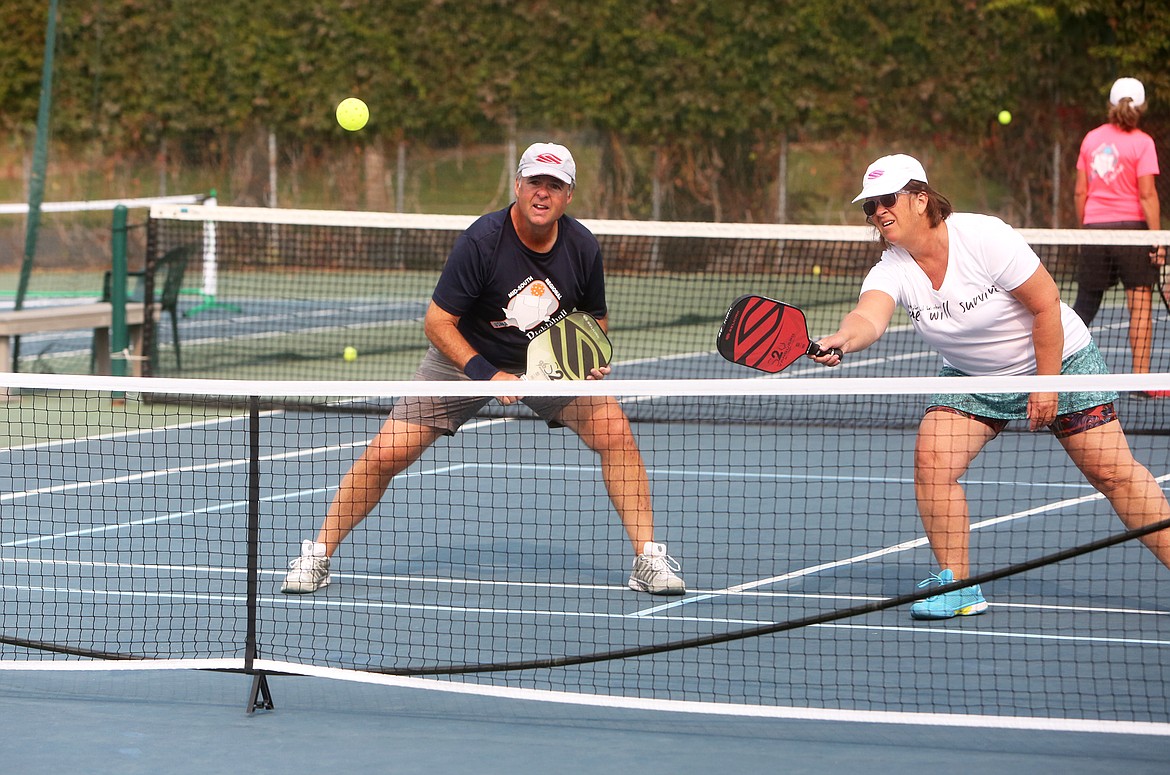 Jim Lafferty, left, plays pickleball last Thursday in Bigfork. Lafferty is one of the investors in the Jewel Basin Center -- a new pickleball and events center in Bigfork.