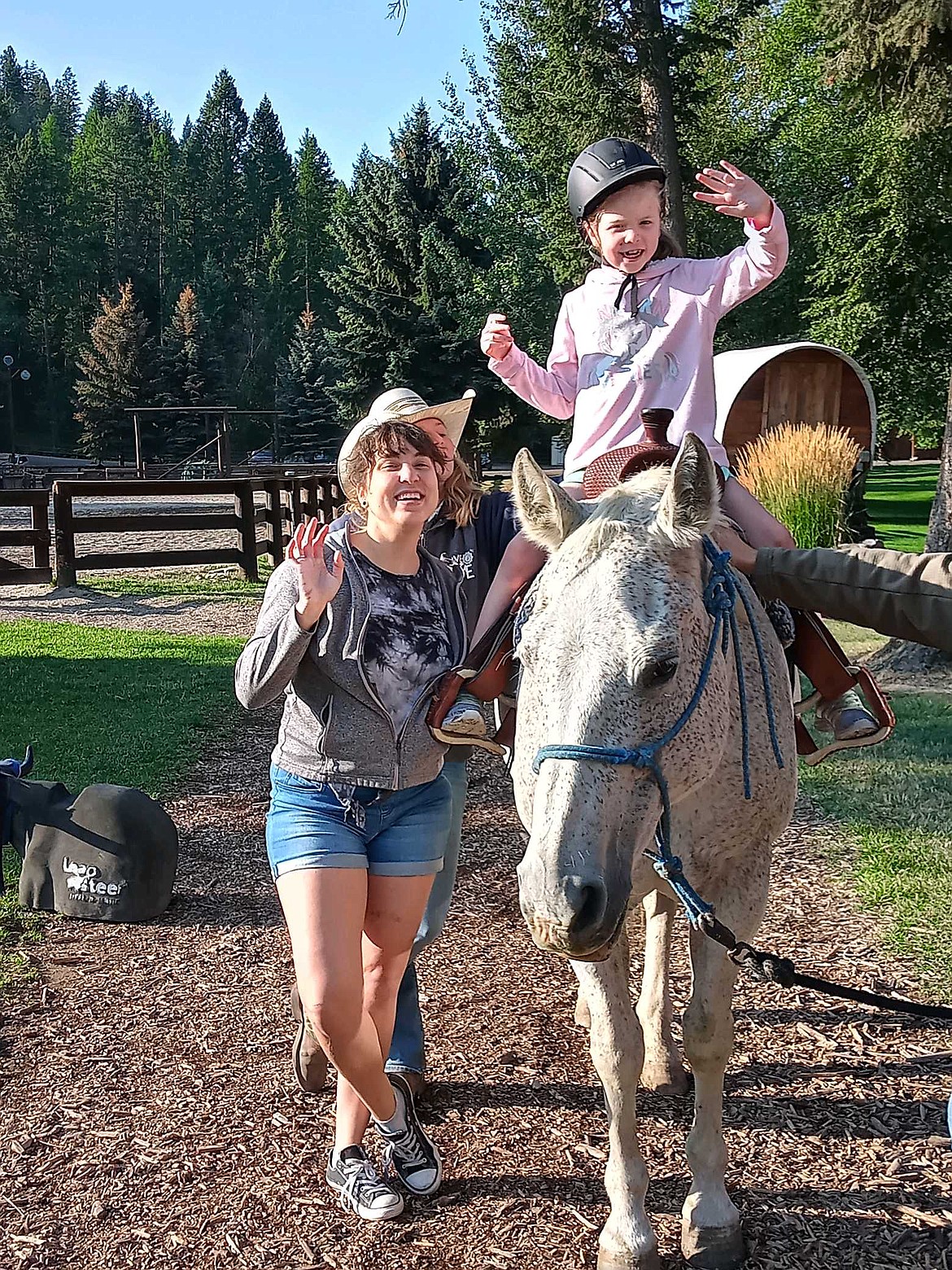 Jordana Hubble, 7, who sustained a traumatic brain injury last fall, waves from atop a horse during the Week of Hope hosted by Flathead Lake Lodge. 
Courtesy Veronica "Vo" Hubble