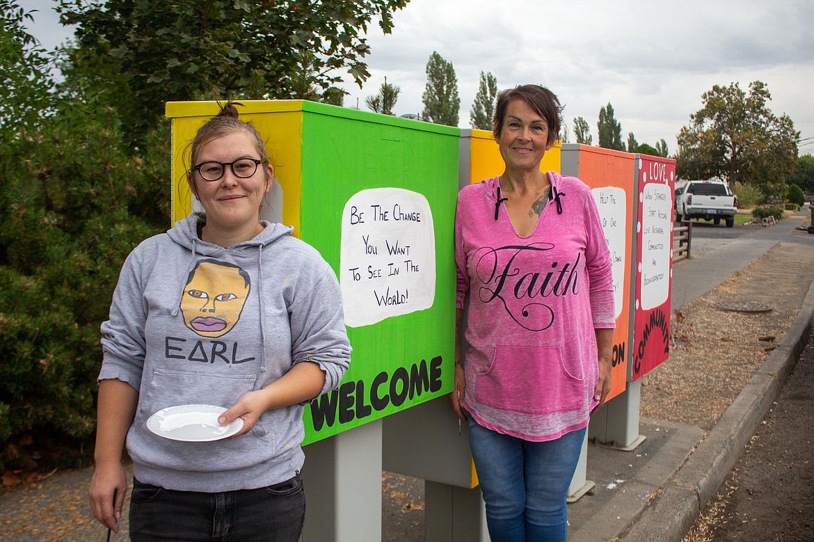Jaymee and Christy Welch showcase one of the sets of mailboxes that they have painted through the Painted Mailbox Project in hopes of deterring graffiti and taggers in the community.