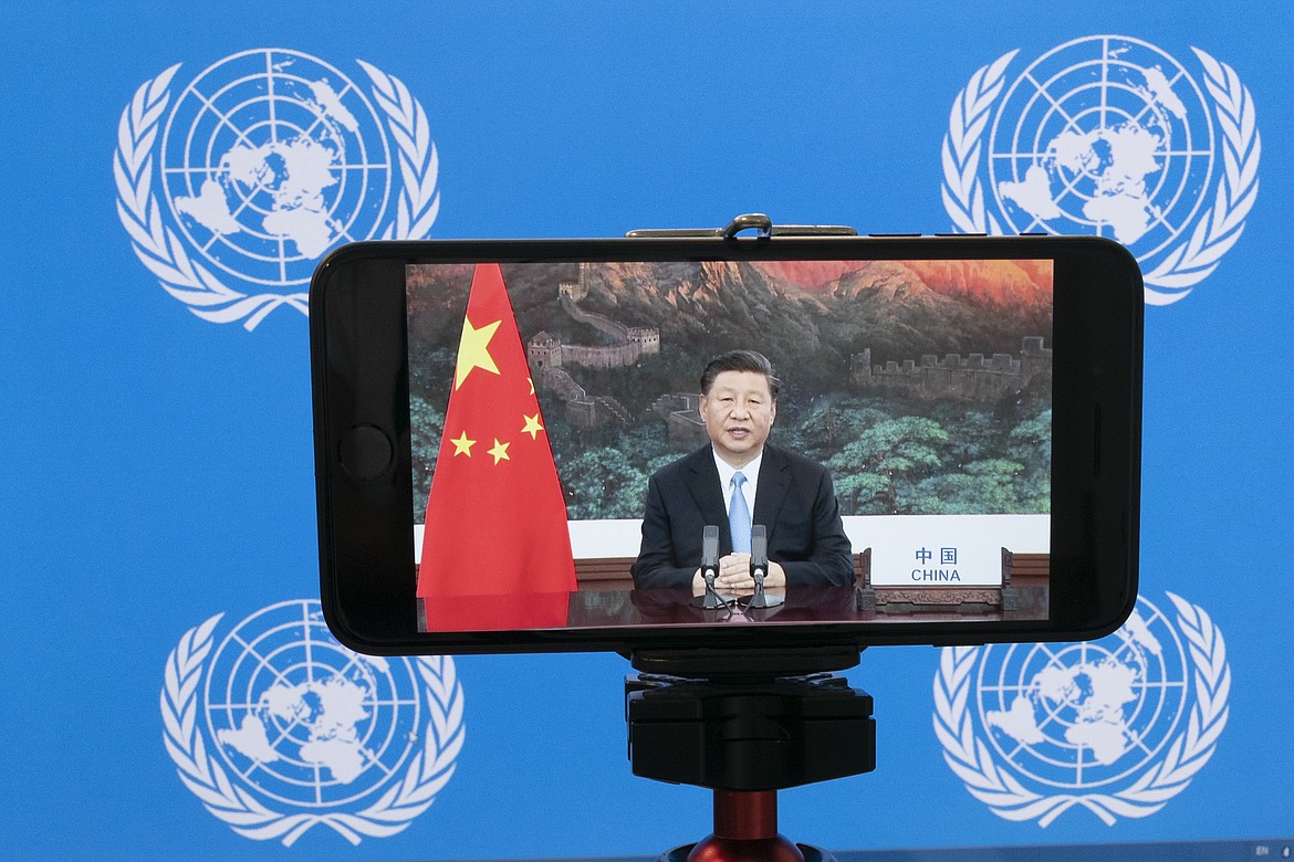 Chinese President Xi Jinping is seen on a video screen remotely addressing the 75th session of the United Nations General Assembly, Tuesday, Sept. 22, 2020, at U.N. headquarters. This year's annual gathering of world leaders at U.N. headquarters will be almost entirely "virtual." Leaders have been asked to pre-record their speeches, which will be shown in the General Assembly chamber, where each of the 193 U.N. member nations are allowed to have one diplomat present.