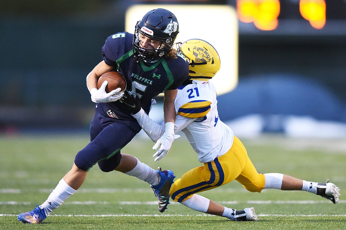 Glacier wide receiver Kale Mayhue (6) is brought down by Missoula Big Sky’s Isaac Ayers (21) on a first-quarter reception at Legends Stadium on Friday. (Casey Kreider/Daily Inter Lake)