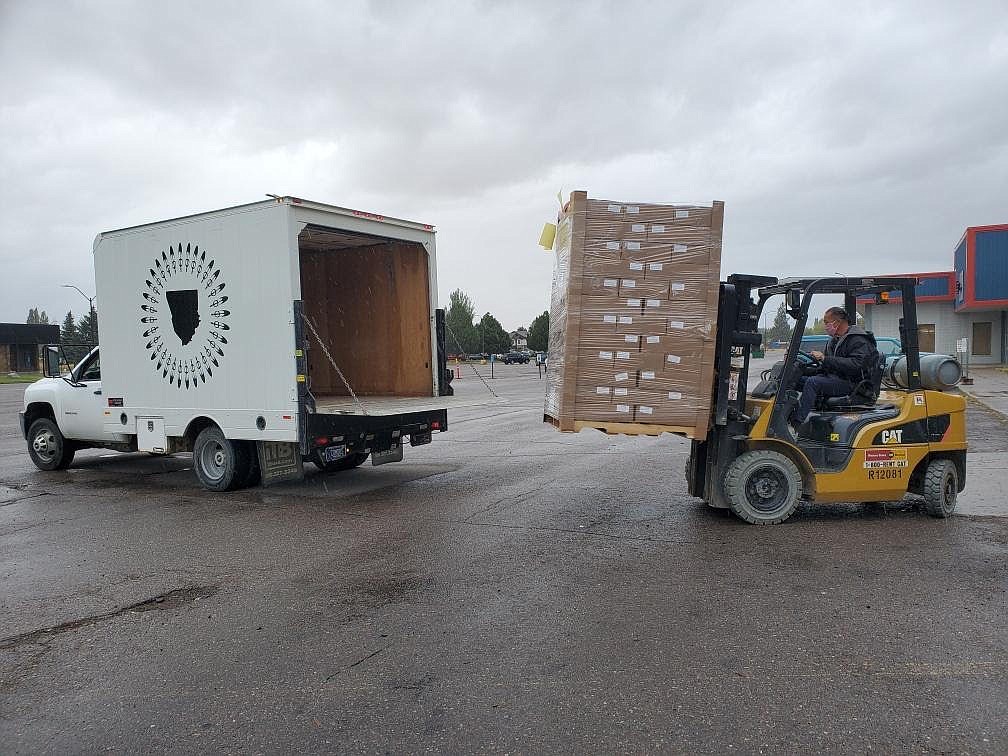 A Flathead Food Bank employee loads food and other supplies into a truck to be delivered to the Blackfeet Reservation. (Photo courtesy of Flathead Food Bank)