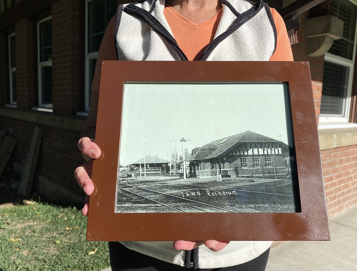 Kandi Johnson, 58, has lived in the old Idaho & Washington Railroad Depot since her father bought the house over a decade ago. She still finds remnants of the building's history it's wood beam architecture and design. (MADISON HARDY/Press)