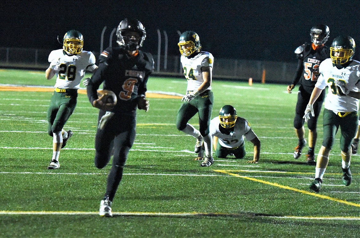 Daniel Kelsch scores the Chiefs' first touchdown on a quarerback keeper in the third quarter. (Scot Heisel/Lake County Leader)