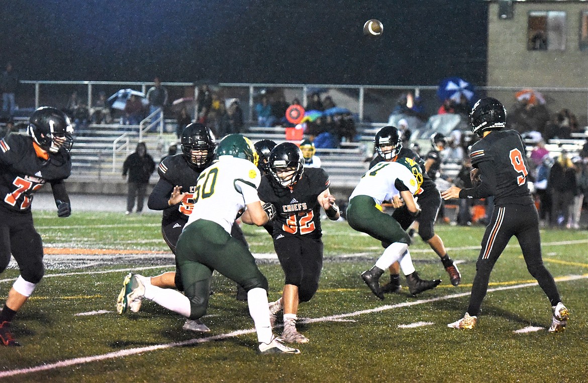 Chiefs quarterback Daniel Kelsch unleashes a pass against Whitefish on Friday night. (Scot Heisel/Lake County Leader)