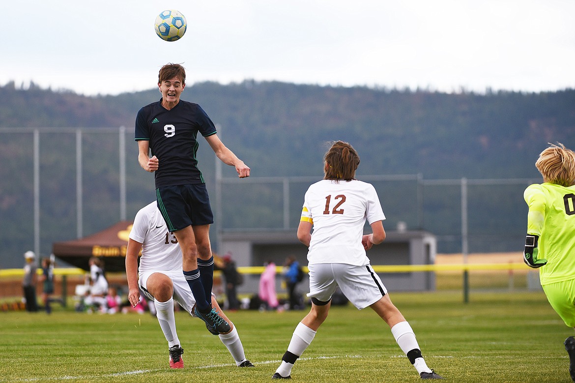 Glacier’s Daniel Camp (9) heads a kick just wide of the net in the first half against Helena Capital at Glacier High School on Saturday. (Casey Kreider/Daily Inter Lake)