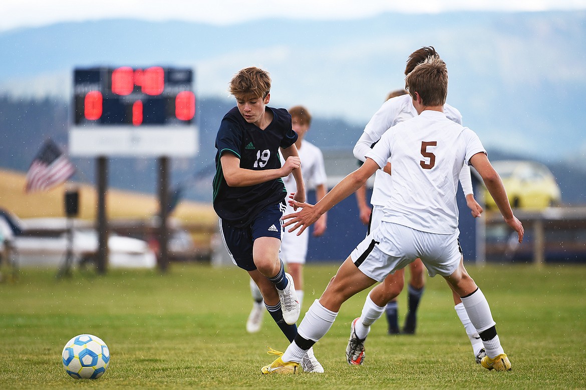 Glacier’s Harrison Sanders (19) moves the ball upfield against Helena Capital at Glacier High School on Saturday. (Casey Kreider/Daily Inter Lake)