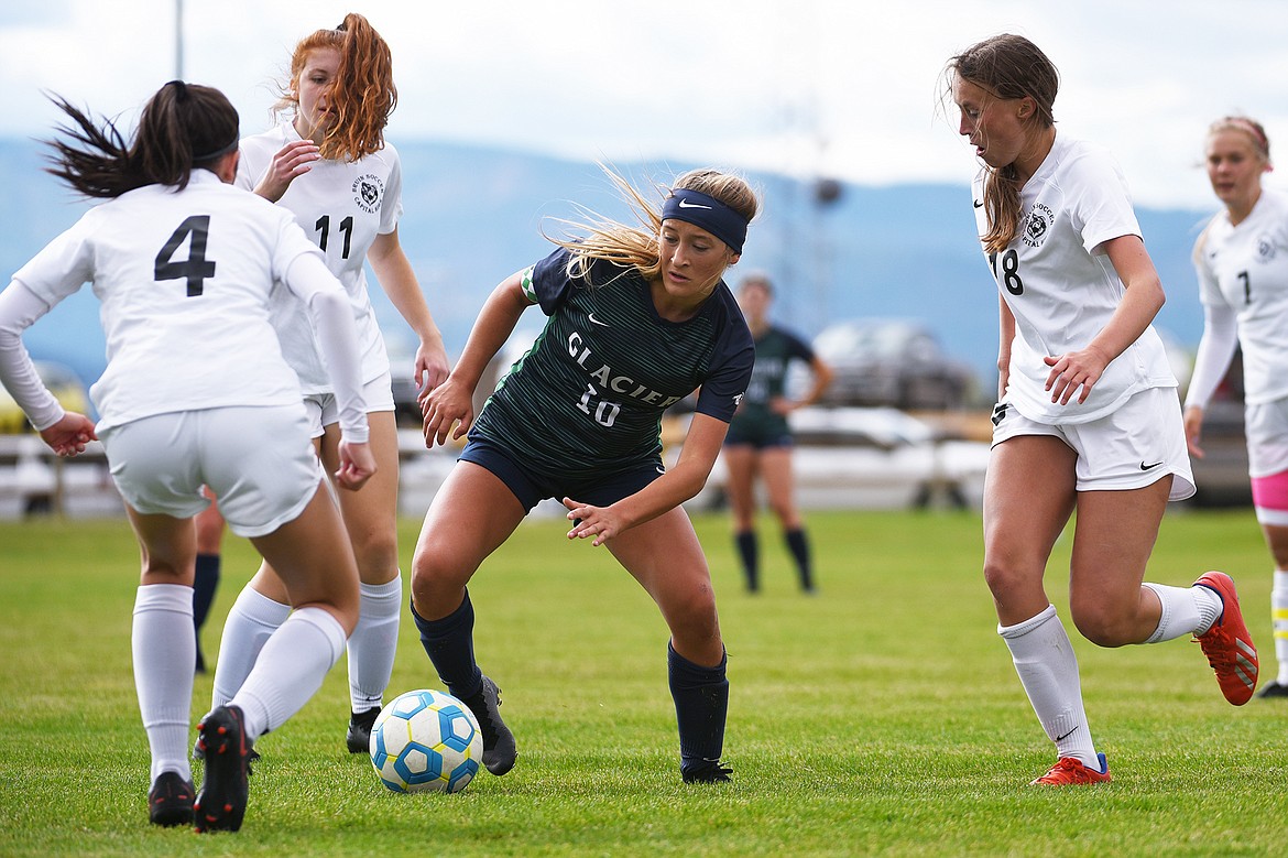 Glacier’s Madison Becker (18) dribbles into traffic against Helena Capital at Glacier High School on Saturday. (Casey Kreider/Daily Inter Lake)