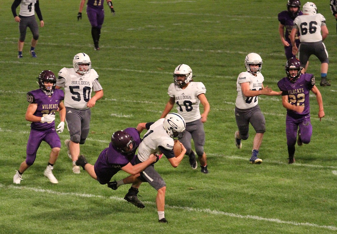 Kellogg's Austin Miller chased down and tackled Grangeville's kick returner during the first half of the Wildcats' home opening loss to the Bulldogs last Friday.