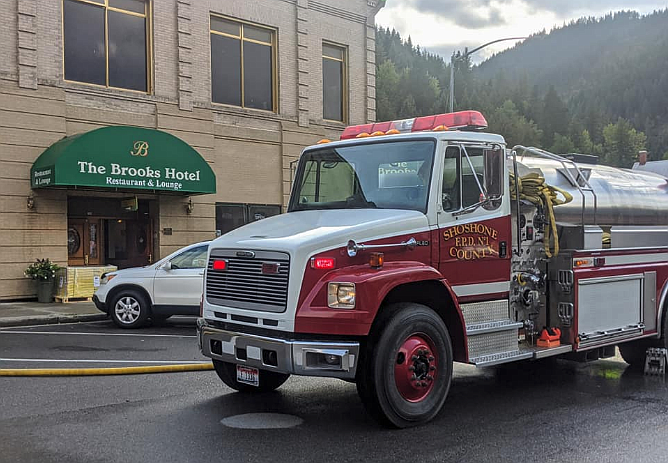 Fire engines with Shoshone County Fire District No. 1 block off a portion of Cedar street while they respond to a fire at the Brooks Hotel last Friday.