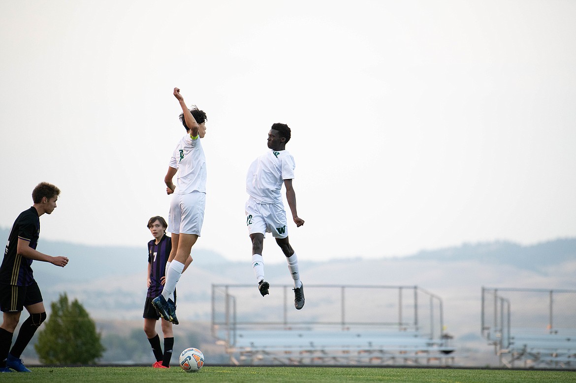 Whitefish forwards Brandon Mendoza and Marvin Kimera celebrate a goal against Polson on Tuesday Sept. 22. (Lot 22 Photography)