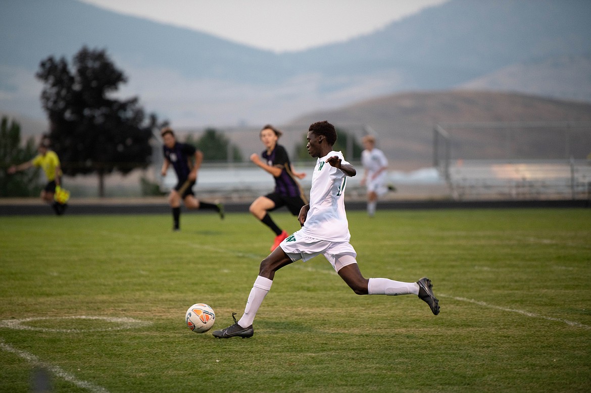 Whitefish forward Marvin Kimera breaks away from the Pirate defense at Polson High School on Sept. 22. (Lot 22 Photography)