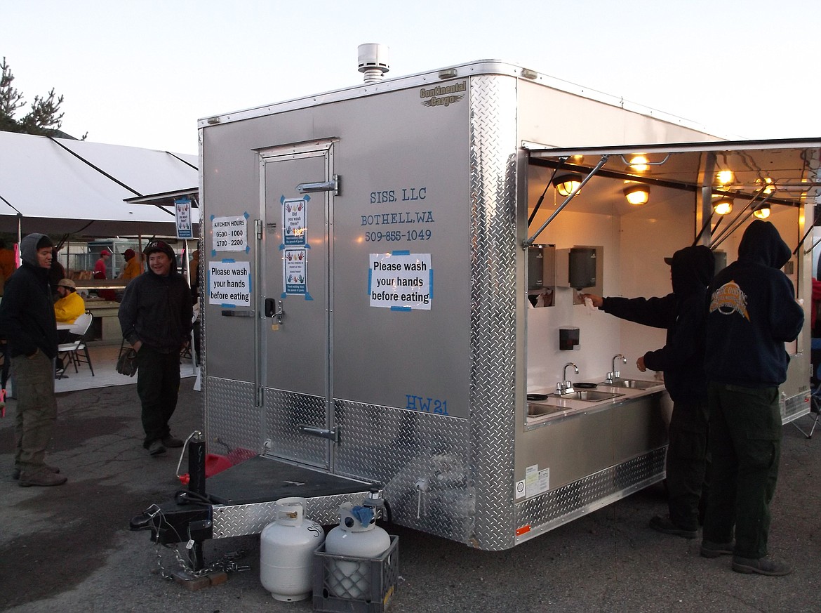 Firefighters at a SISS hand washing station during the Carlton Complex Fire in 2014.