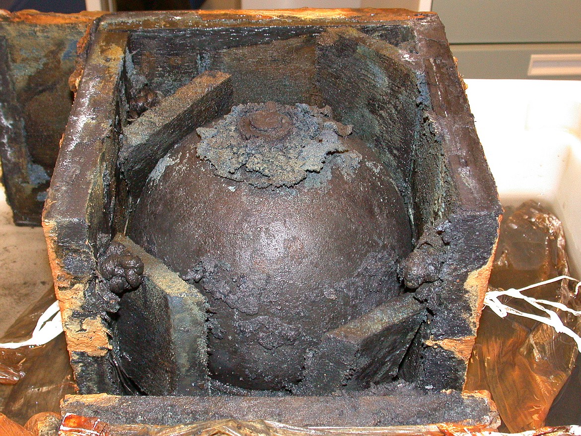 Shell recovered from the wreck of the CSS Alabama during 2001-02 excavation still in original wooden case, held together with a rope, the ball fired from the USS Kearsarge never exploding but jammed the rudder and required four to man the helm.