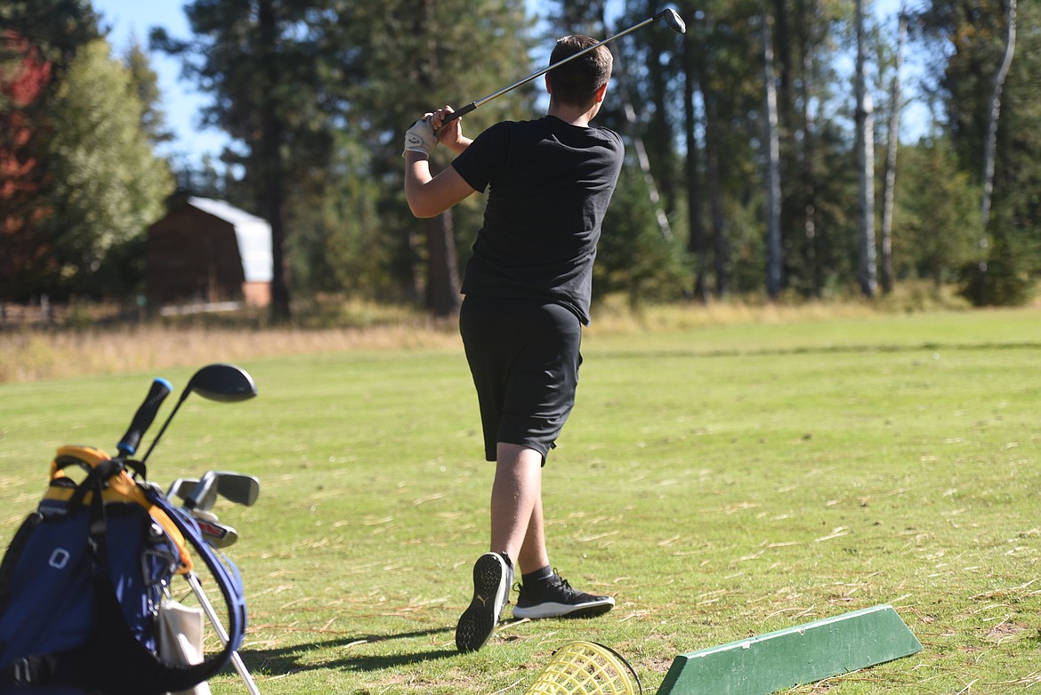 Mason Gotham follows through on drive during a Sept. 29 golf practice. Gotham and three of his other teammates headed off to the state championship in Butte on Sept. 30.