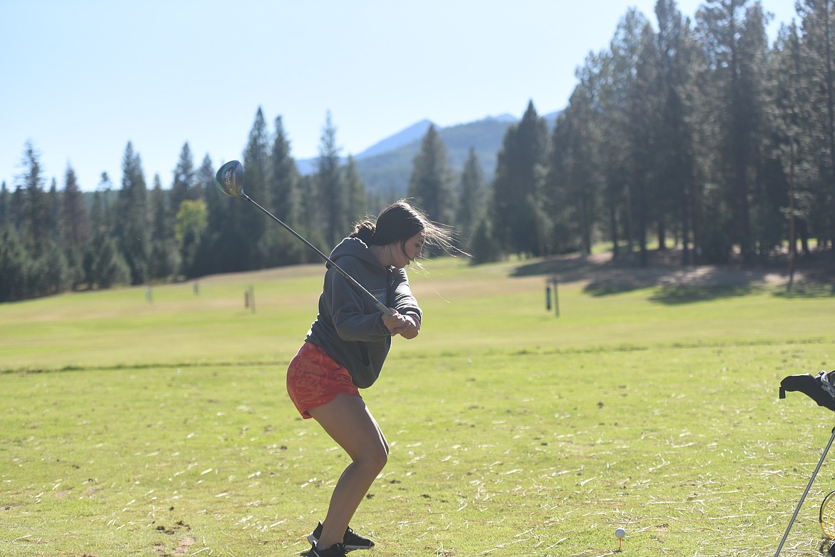 Kayley Svendsbye practices her drive at the Cabinet View Golf Course on Sept. 29. She and three other Loggers headed to state championships in Butte on Sept. 30.