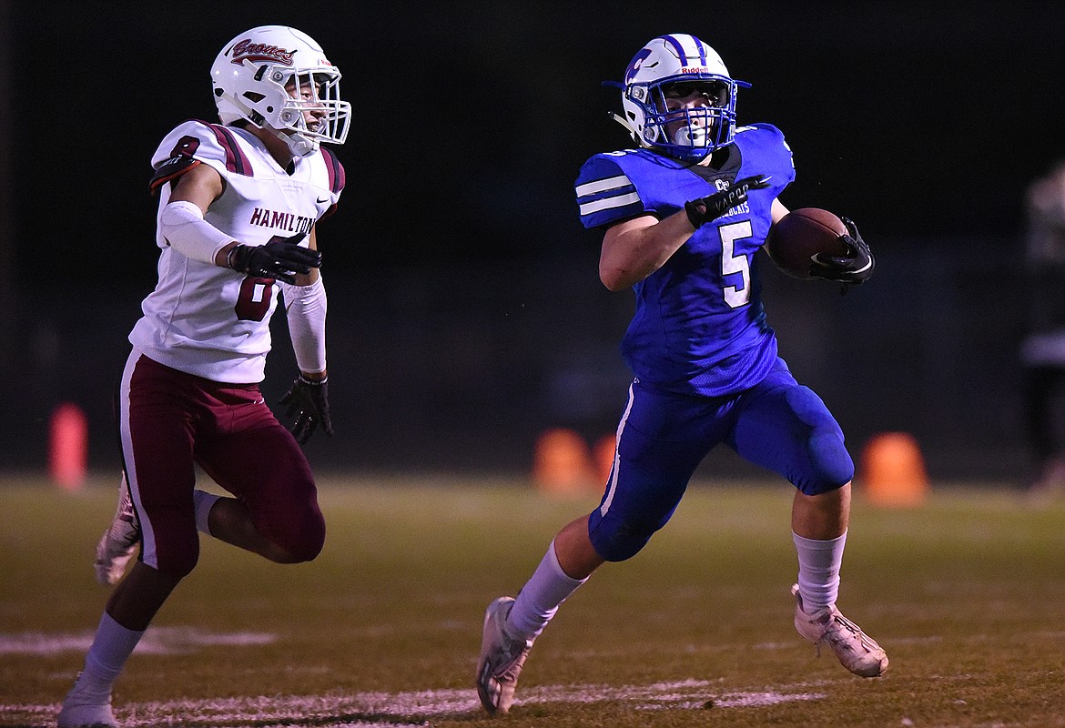 Columbia Falls running back Isaiah Roth (5) breaks a long run from scrimmage in the first half against Hamilton at Satterthwaite Memorial Field in Columbia Falls on Friday. (Casey Kreider/Daily Inter Lake)