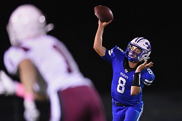 Columbia Falls quarterback Mason Peters (8) looks to throw in the third quarter against Hamilton at Satterthwaite Memorial Field in Columbia Falls on Friday. (Casey Kreider/Daily Inter Lake)