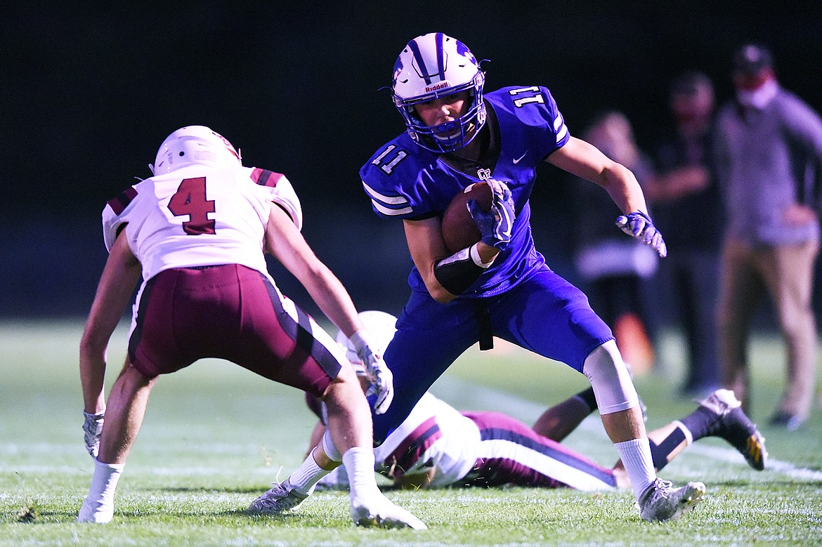 Columbia Falls wide receiver Zane McCallum (11) looks upfield after a second quarter reception against Hamilton at Satterthwaite Memorial Field in Columbia Falls on Friday. (Casey Kreider/Daily Inter Lake)