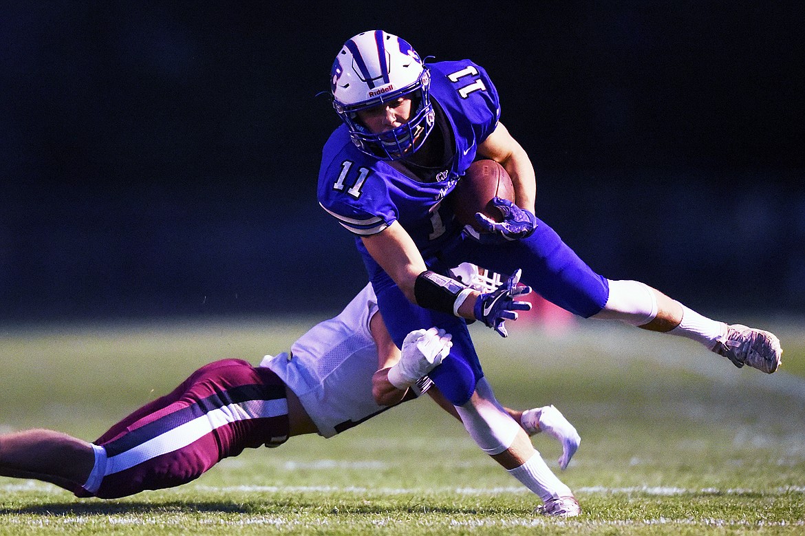 Columbia Falls wide receiver Zane McCallum (11) looks upfield after a second quarter reception against Hamilton at Satterthwaite Memorial Field in Columbia Falls on Friday. (Casey Kreider/Daily Inter Lake)
