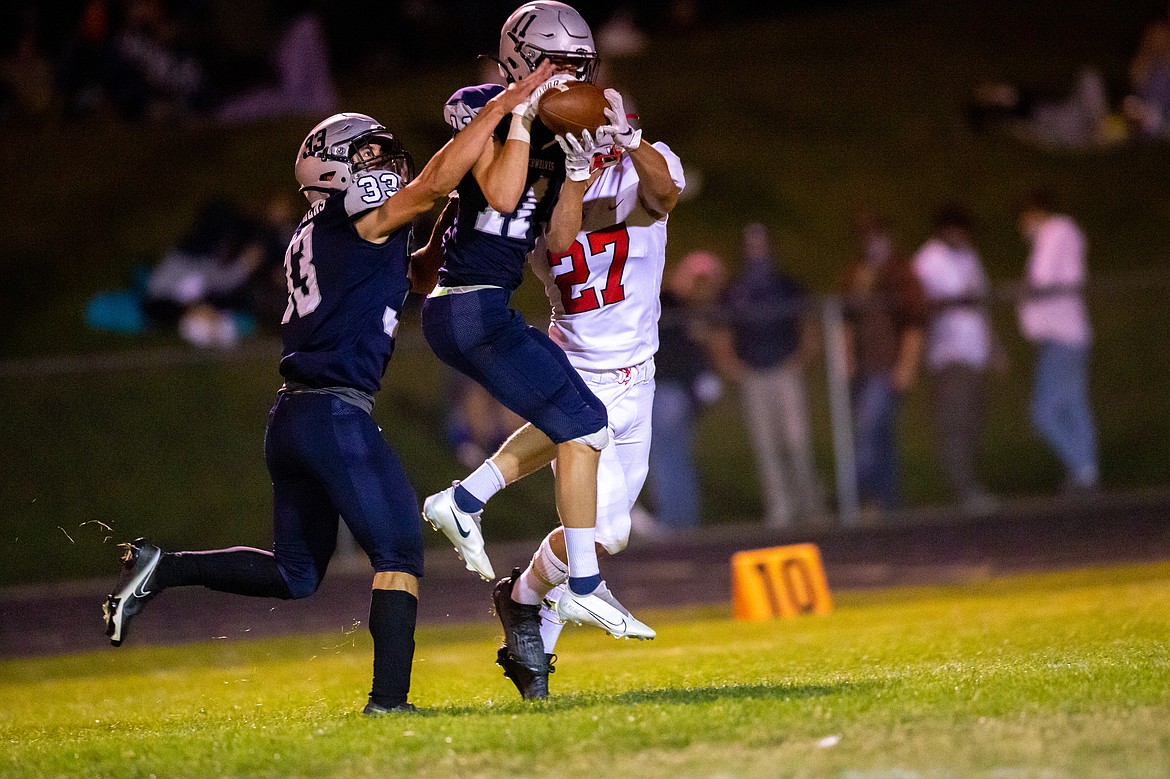 Photo by JASON DUCHOW PHOTOGRAPHY
With his team trailing 13-6, Damon Rosenau of Lake City intercepts a Sandpoint pass early in the fourth quarter. The Timberwolves scored twice in the quarter to win 21-13.