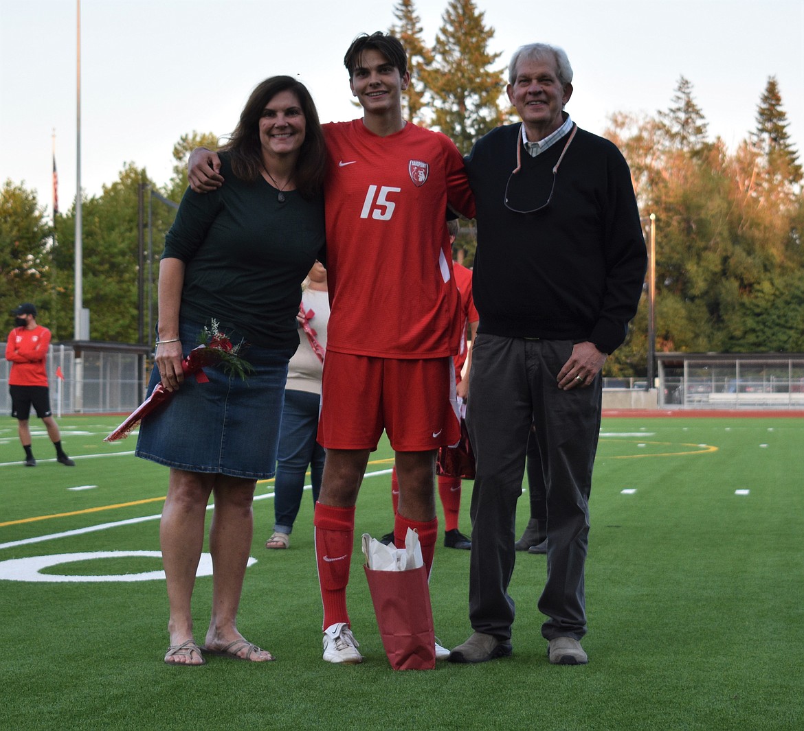 Chris Koch poses for a photo with his family on Senior Night.