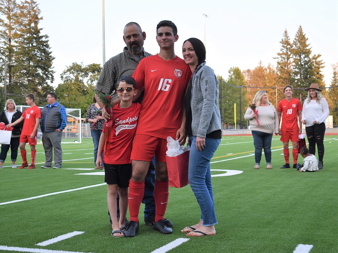 Conagher McCown poses for a photo with his family on Senior Night.