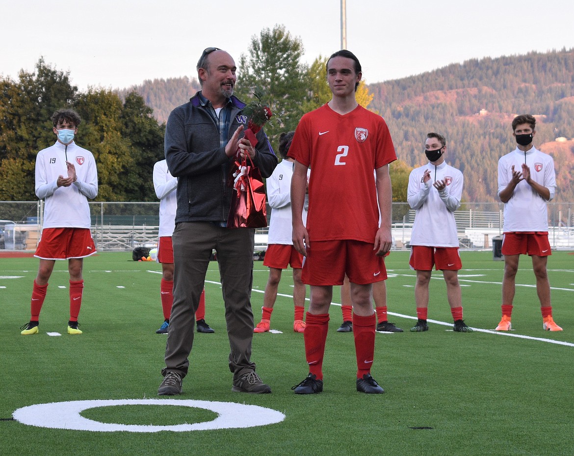 Wil Auld poses for a photo with his dad on Senior Night.