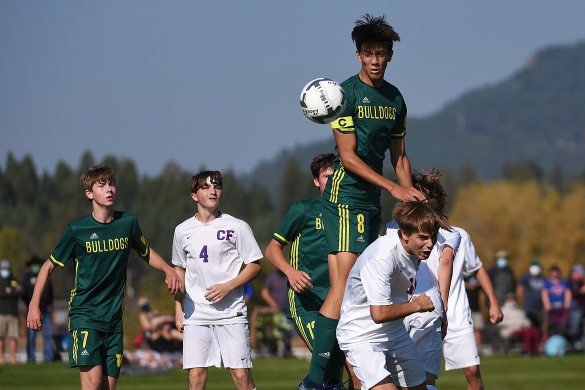 Whitefish’s Brandon Mendoza (8) goes up for a header against Columbia Falls at Smith Fields in Whitefish on Saturday. (Casey Kreider/Daily Inter Lake)