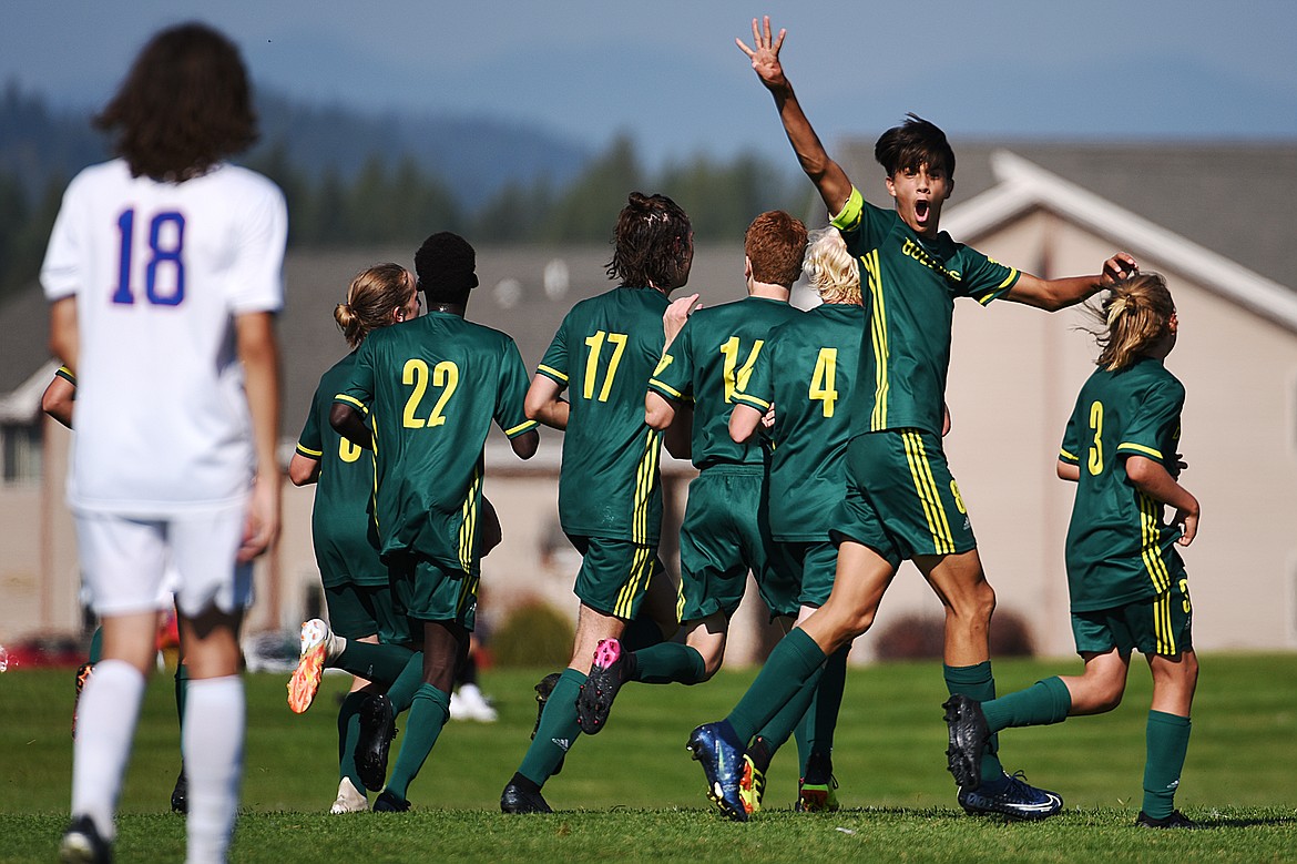 Whitefish’s Brandon Mendoza (8) holds up four fingers after the Bulldogs’ fourth goal of the second half against Columbia Falls at Smith Fields in Whitefish on Saturday. (Casey Kreider/Daily Inter Lake)