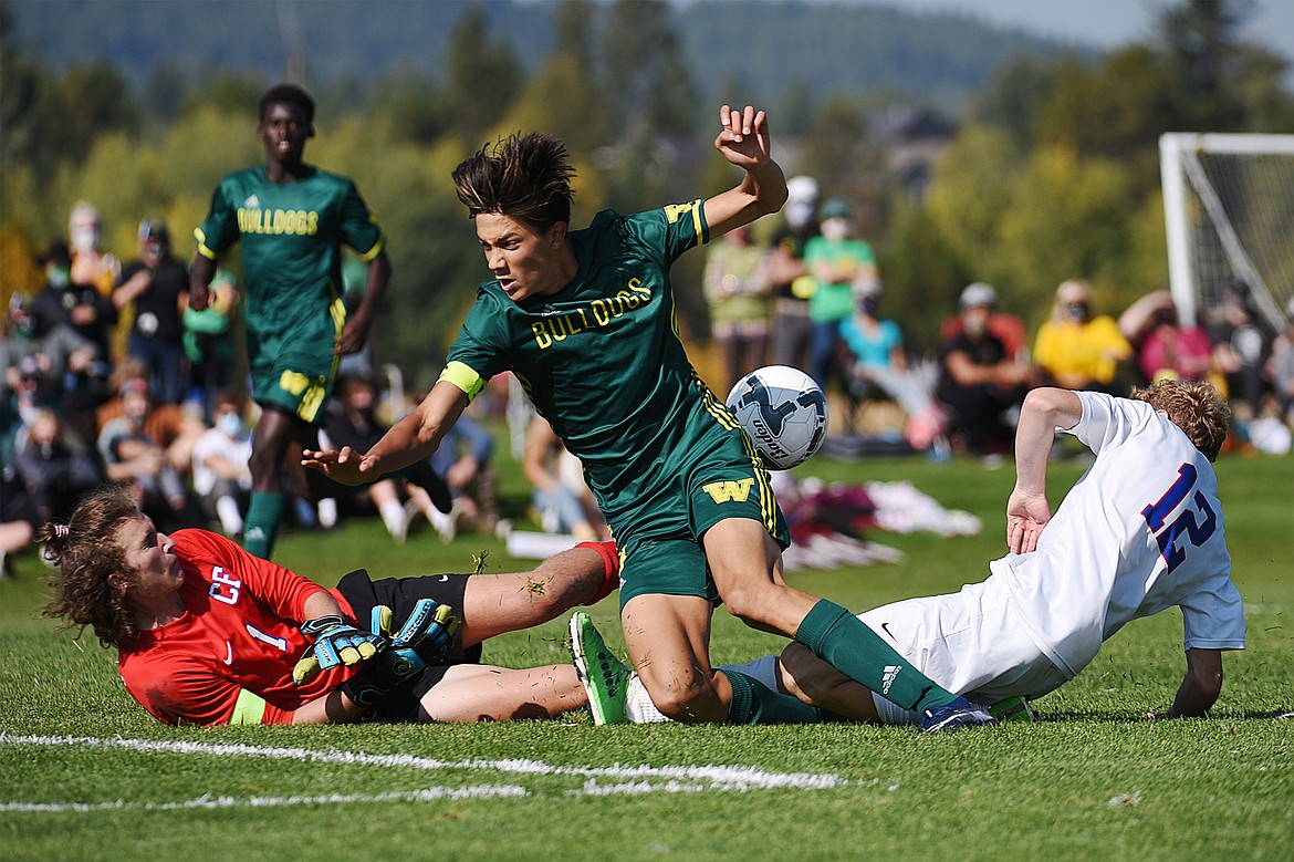 Whitefish’s Brandon Mendoza (8) has a scoring attempt stopped by Columbia Falls goalkeeper Niles Getts (1) in the second half at Smith Fields in Whitefish on Saturday. (Casey Kreider/Daily Inter Lake)