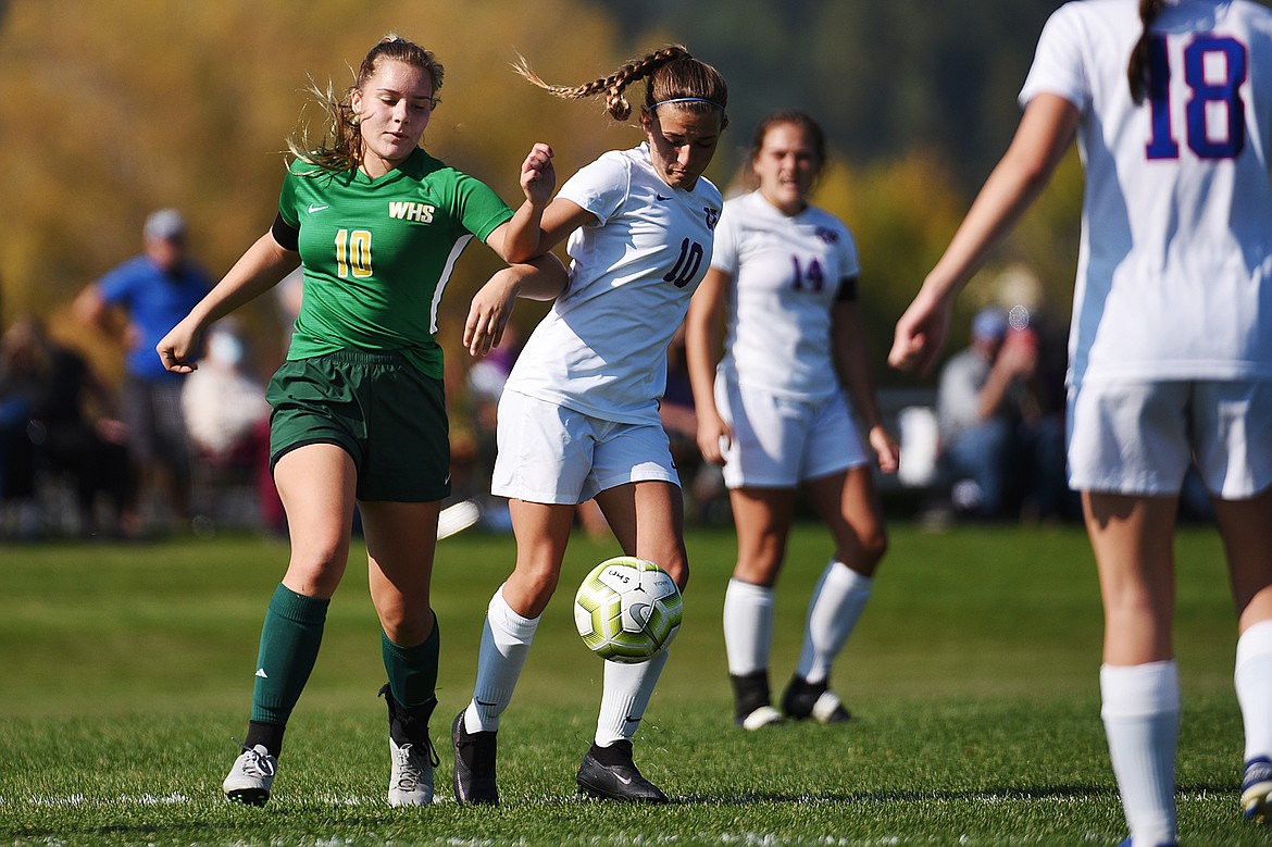 Whitefish’s Ali Hirsch (10) and Columbia Falls’ Alexis Green (10) battle for possession in the second half at Smith Fields in Whitefish on Saturday. (Casey Kreider/Daily Inter Lake)