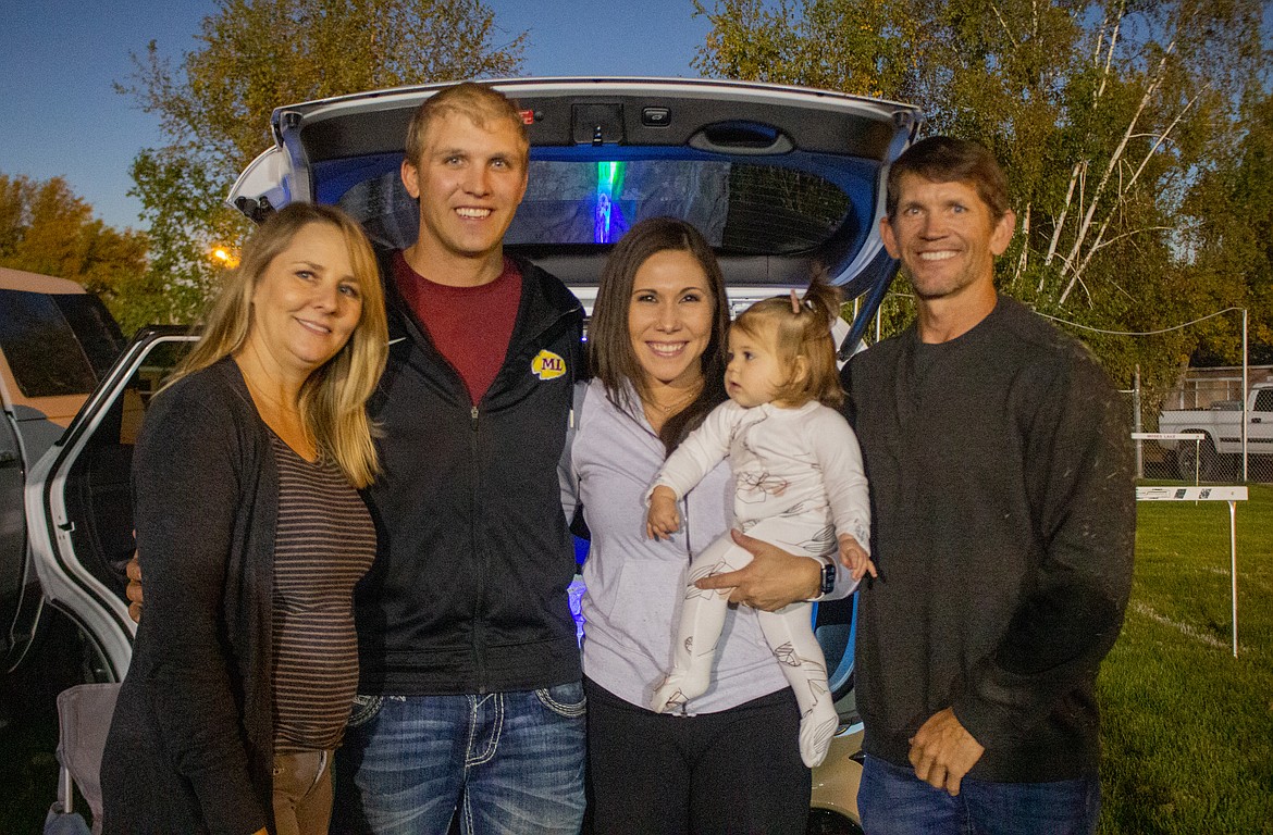 From left: Tara Newton, Jacob Newton, Jade Newton, young Ember Ray Newton and Mark Newton came out to Lions Field on Friday night to watch Jacob's 2007 Moses Lake Chiefs football team take on Eisenhower in the Homecoming battle. Jacob Newton asked his wife, Tara, to that very Homecoming dance 13 years ago.