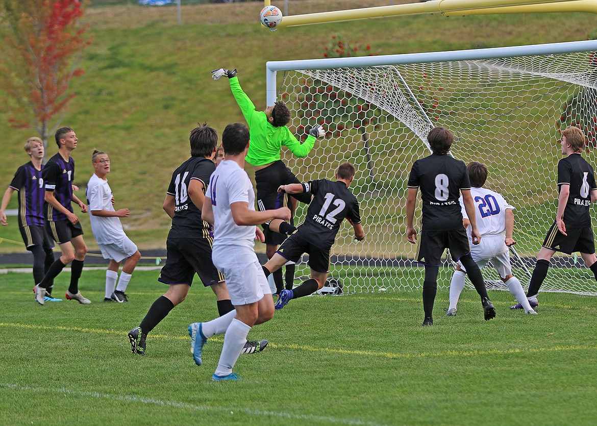 Polson goal tender Tristan Clifford gets a save against Columbia Falls. (Bob Gunderson)