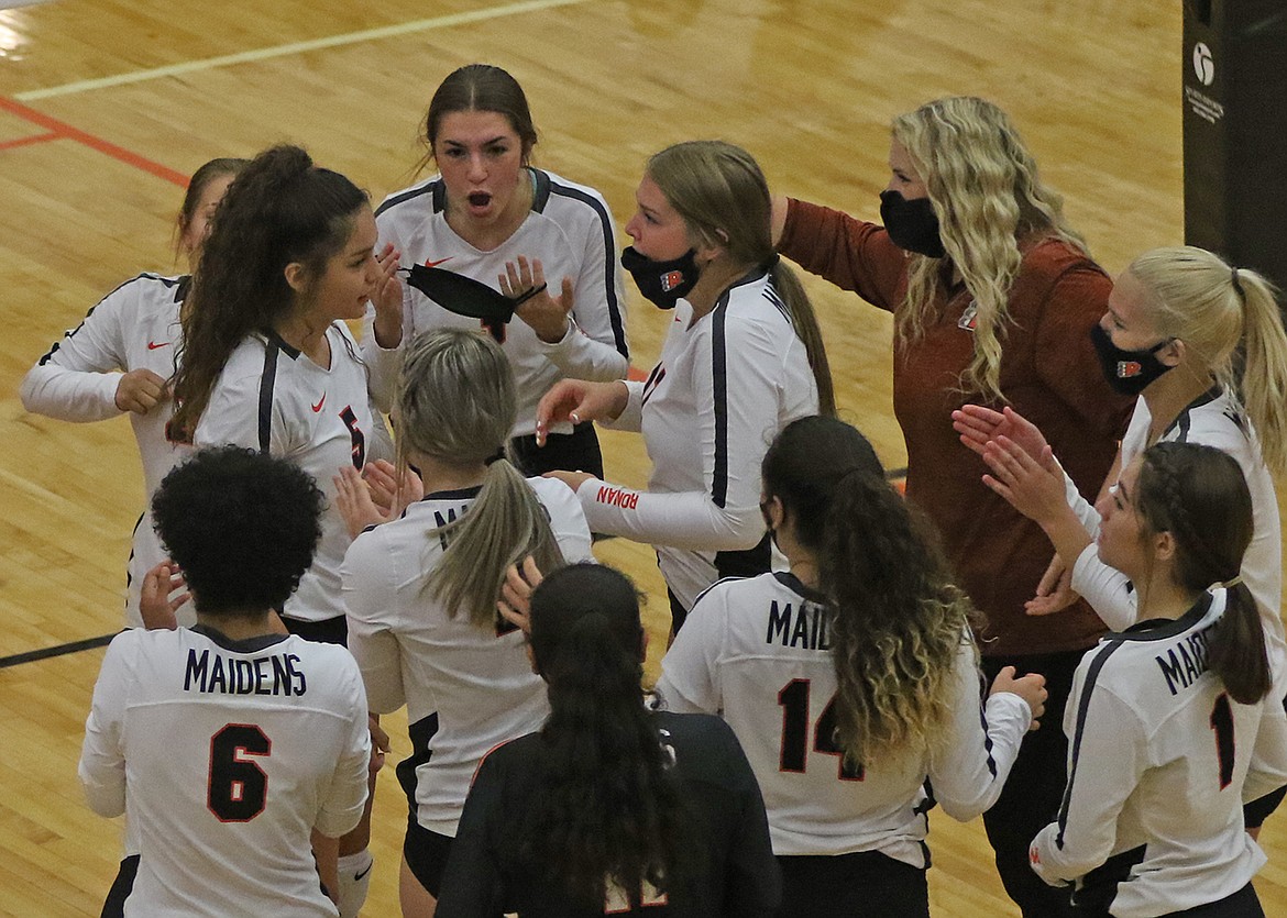 The Maidens celebrate their home victory over Polson. (Bob Gunderson)