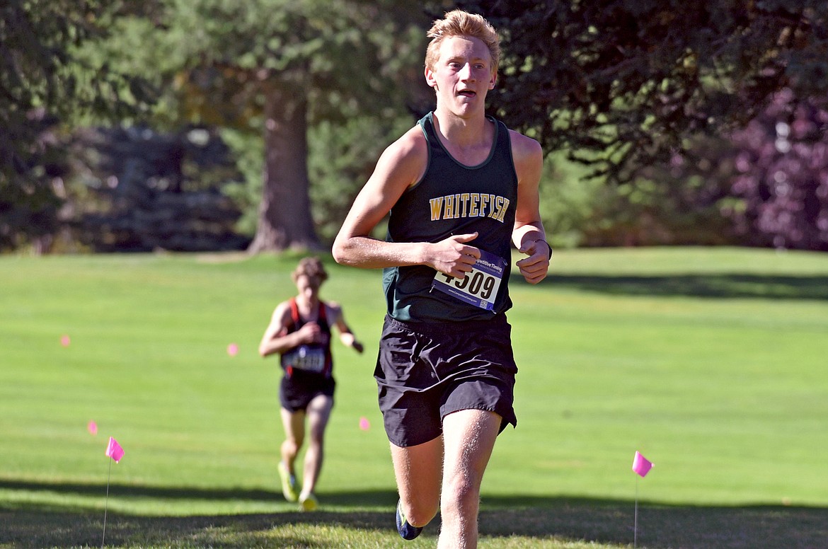 Whitefish runner Ruedi Steiner competes at the Stumptown Triangular at Whitefish Lake Golf Club on Tuesday, Sept. 29. He was the third fastest boy runner for the Bulldogs. (Whitney England/Whitefish Pilot)