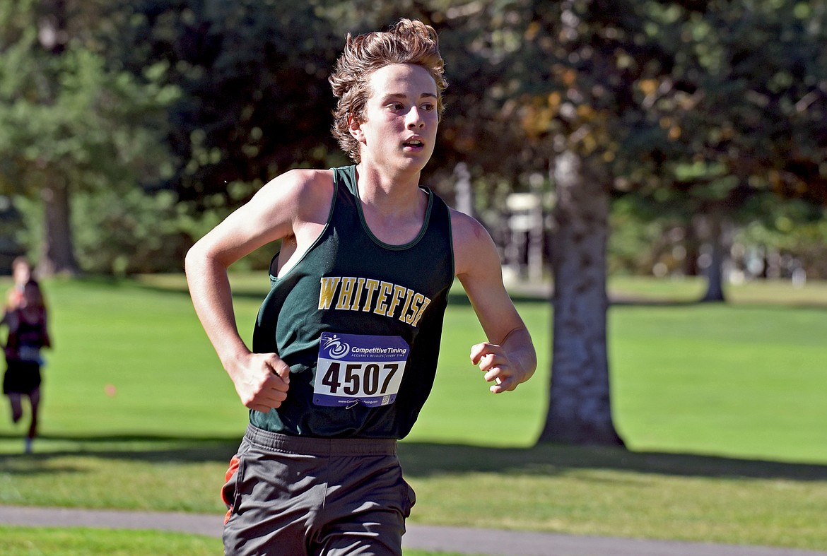 Bulldog Deneb Linton runs to a seventh place finish and was Whitefish's second fastest runner at the Stumptown Triangular at Whitefish Lake Golf Club on Tuesday, Sept. 29. (Whitney England/Whitefish Pilot)