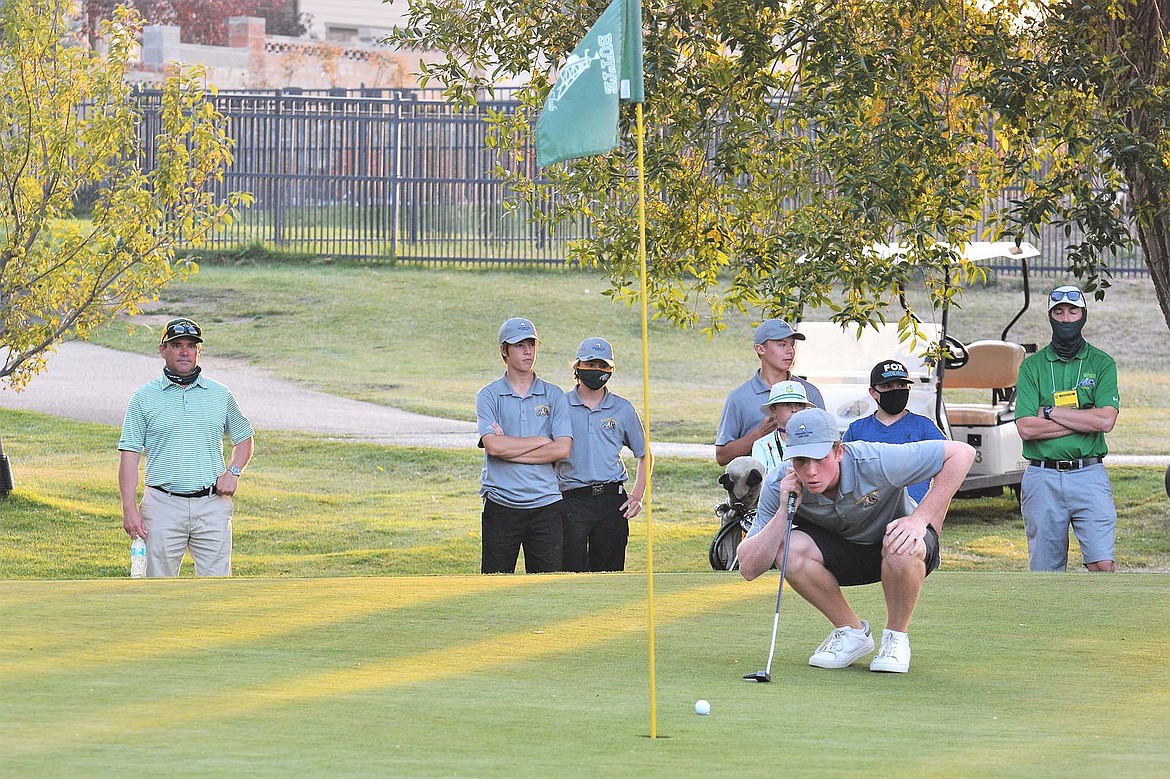 Bulldog Cameron Kahle lines up his putt to win the tournament and state championship in a sudden-death playoff in Butte. (Jeff Doorn photo)