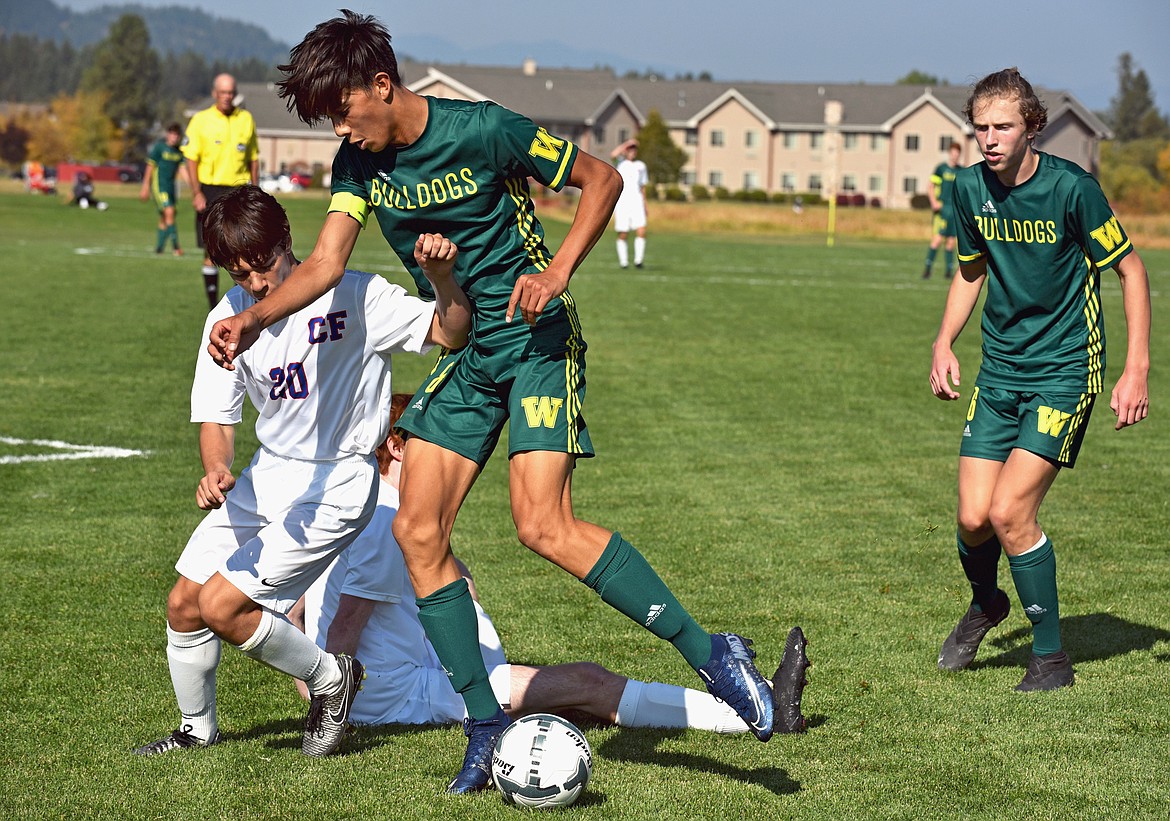 Whitefish senior forward Brandon Mendoza challenges a Columbia Falls player in a game at Smith Fields on Saturday. (Whitney England/Whitefish Pilot)